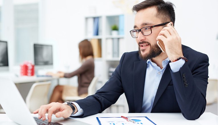 Department teammate speaking on the phone in the office